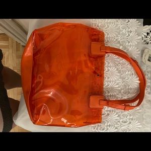Orange clear small bag .